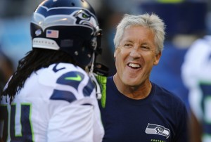 Seattle Seahawks head coach Pete Carroll smiles as he chats with running back Marshawn Lynch in San Diego